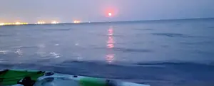 Морской каякинг при лунном свете